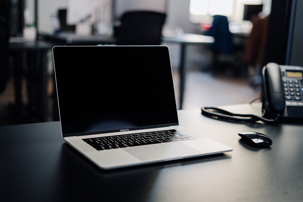 Laptop and phone on a clean desk